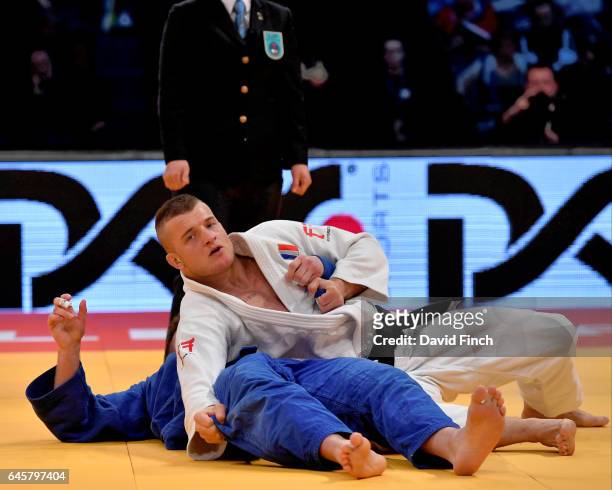Michael Korrel of the Netherlands holds Benjamin Fletcher of Great Britain for an ippon to win the u100kg bronze medal during the 2017 Dusseldorf...