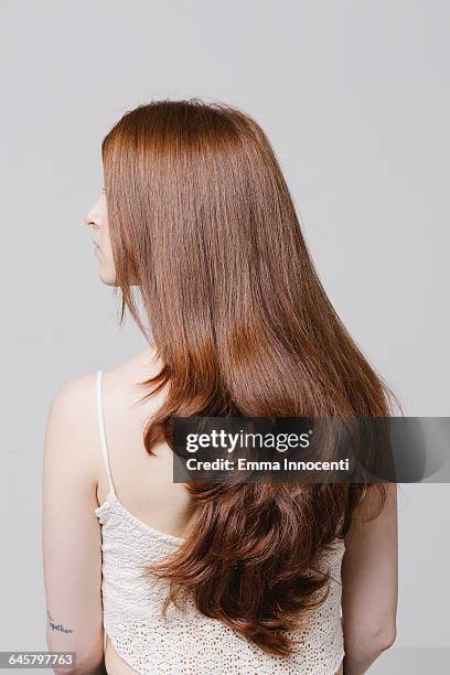 profile of young woman with beautiful red hair - long hair ストックフォトと画像