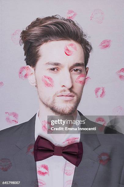 young man covered by kisses - versierd jak stockfoto's en -beelden