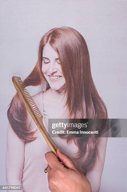 Combing hair of a young woman