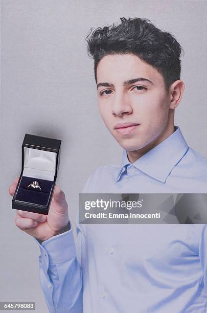 young man proposing - man holding ring box stock pictures, royalty-free photos & images