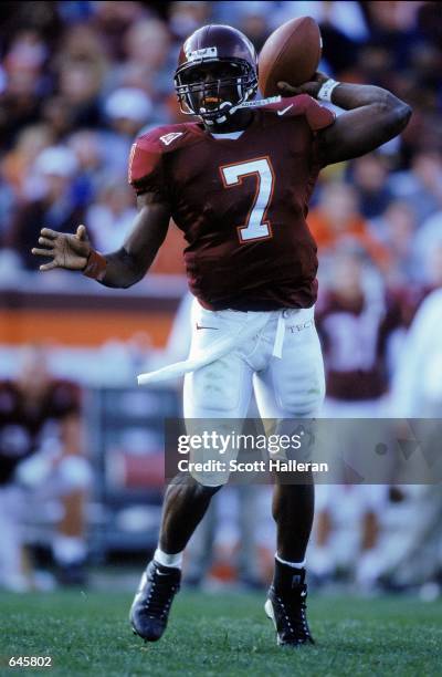 Michael Vick of the Virginia Tech Hokies throws the ball during the game against the Pittsburgh Panthers at Blacksburgh, Virginia. The Hokies...