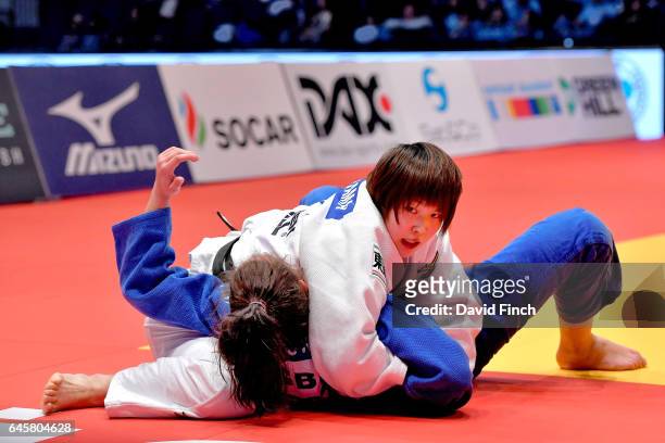 Rika Takayama of Japan holds Natalie Powell of Great Britain for an ippon to win the u78kg bronze medal during the 2017 Dusseldorf Grand Prix at the...