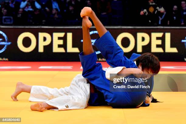 Mami Umeki of Japan held Madeleine Malonga of France for an ippon to win the u78kg final and gold medal during the 2017 Dusseldorf Grand Prix at the...