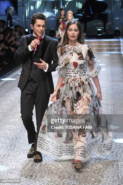 Model Marie-Ange Casta walks the runway with singer Austin Mahone during the show for fashion house Dolce & Gabbana during the Women's Fall/Winter...