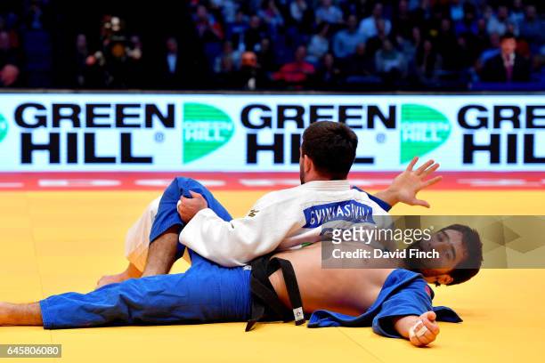 Beka Gviniashvili of Georgia easily holds Khusen Khalmurzaev of Russia for an ippon to win the u90kg final and the gold medal during the 2017...