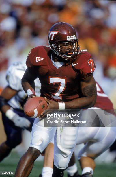 Michael Vick of the Virginia Tech Hokies moves with the ball during the game against the Pittsburgh Panthers at Blacksburgh, Virginia. The Hokies...
