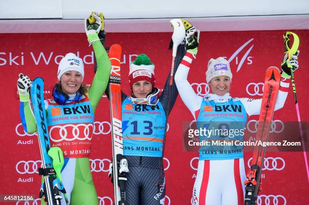 Ilka Stuhec of Slovenia takes 2nd place, Federica Brignone of Italy takes 1st place, Michaela Kirchgasser of Austria takes 3rd place during the Audi...