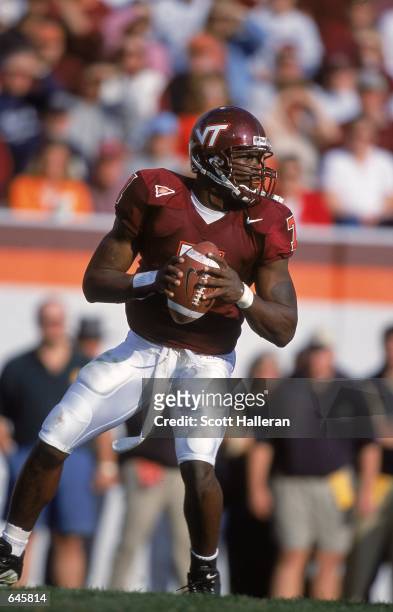 Michael Vick of the Virginia Tech Hokies drops back to pass during the game against the Pittsburgh Panthers at Blacksburgh, Virginia. The Hokies...