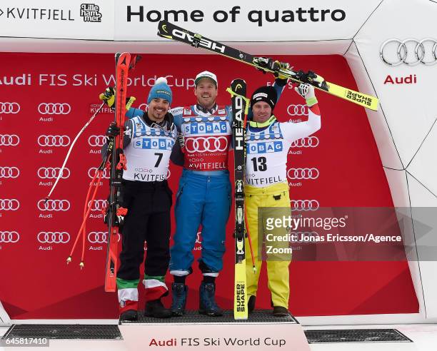 Peter Fill of Italy takes 2nd place, Kjetil Jansrud of Norway takes 1st place, Beat Feuz of Switzerland takes 3rd place during the Audi FIS Alpine...