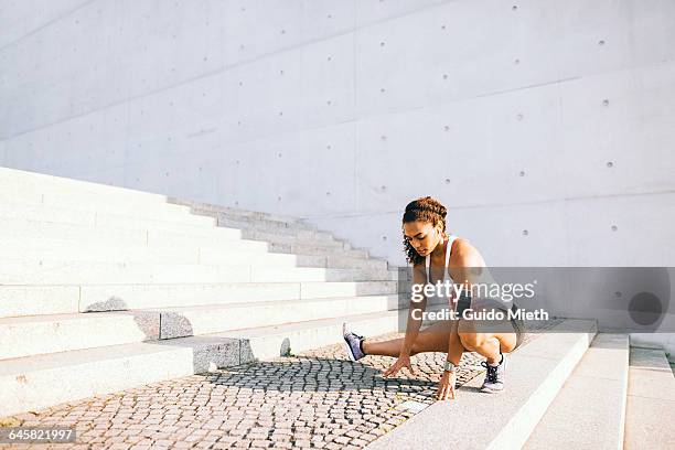 woman doing stretching. - fitness armband stockfoto's en -beelden