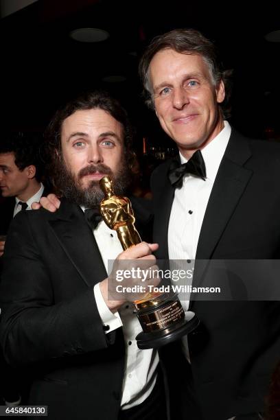 Actor Casey Affleck with his award for best actor in 'Manchester By The Sea' and Amazon SVP Jeff Blackburn attend the Amazon Studios Oscar...