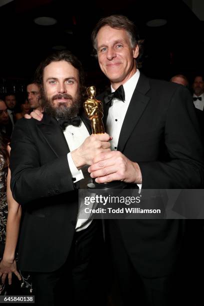 Actor Casey Affleck with his award for best actor in 'Manchester By The Sea' and Amazon SVP Jeff Blackburn attend the Amazon Studios Oscar...