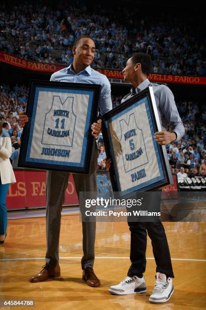 Former North Carolina Tar Heels student-athletes Brice Johnson and Marcus Paige are honored to mark their jerseys being honored during halftime...