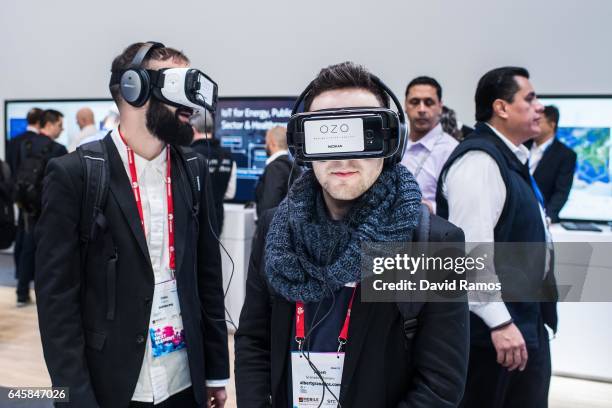 Visitors enjoy a Nokia OZO virtual reality experience during the Mobile World Congress 2017 on the opening day of the event at the Fira Gran Via...