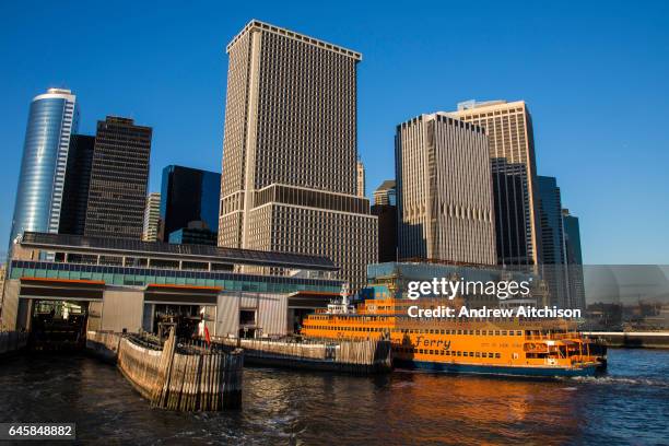 Famous orange Staten Island Ferry waits in the Whitehall Terminal in Lower Manhattan, New York City, New York, United States of America. The Staten...