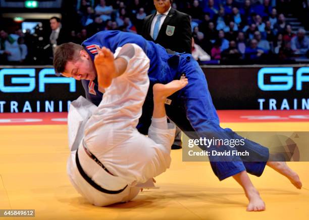 Benjamin Fletcher of Great Britain throws Johannes Frey of Germany for an ippon on his way to the u100kg semi-final during the 2017 Dusseldorf Grand...