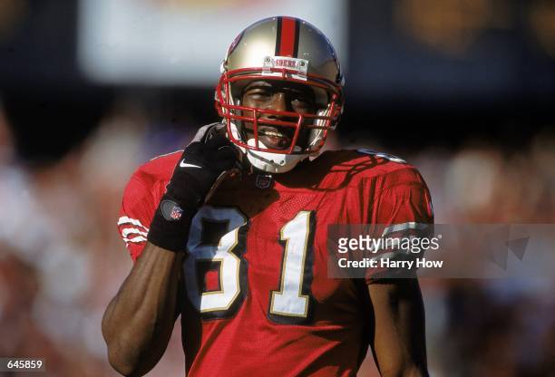Terrell Owens of the San Francisco 49ers clips his chin strap during a game against the St. Louis Rams at 3Com Park in San Francisco, California. The...