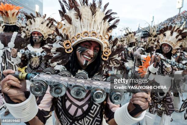 Revellers of Beija-Flor perform during the first night of Rio's Carnival at the Sambadrome in Rio de Janeiro, Brazil, early on February 27, 2017. /...
