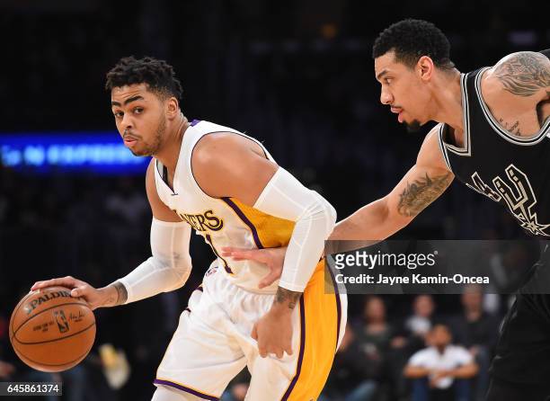 Danny Green of the San Antonio Spurs guards D'Angelo Russell of the Los Angeles Lakers during the game at Staples Center on February 26, 2017 in Los...
