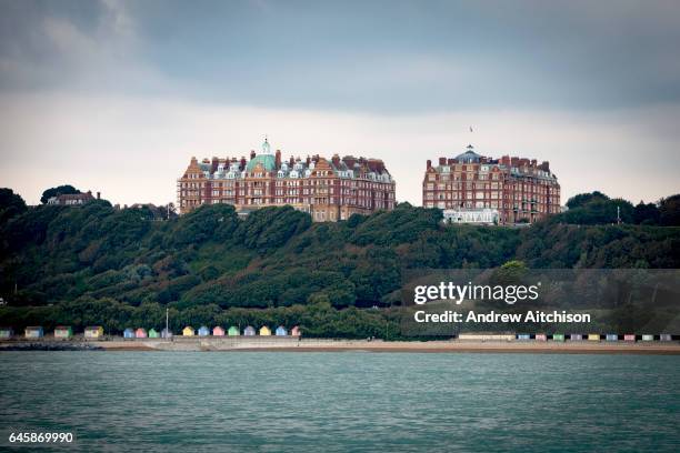 The iconic buildings of Metropole and The Grand buildings stand on The Leas at the top of Radnor Cliff tree lined hill, below is the Lower Leas...