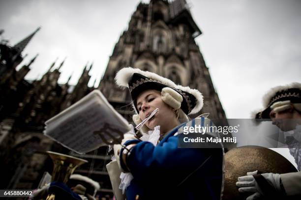 Carneval members attend Rose Monday parade on February 27, 2017 in Cologne next to the Cathedral, Germany. Political satire is a traditional...