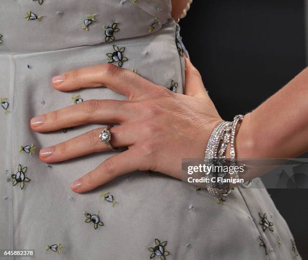 Miranda Kerr, jewelry detail, attends the 2017 Vanity Fair Oscar Party hosted by Graydon Carter at Wallis Annenberg Center for the Performing Arts on...