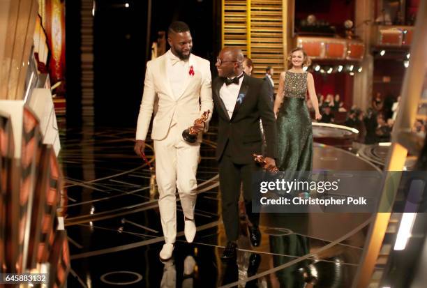 Screenwriter Tarell Alvin McCraney and writer/director Barry Jenkins accept the Best Adapted Screenplay award for 'Moonlight' onstage during the 89th...