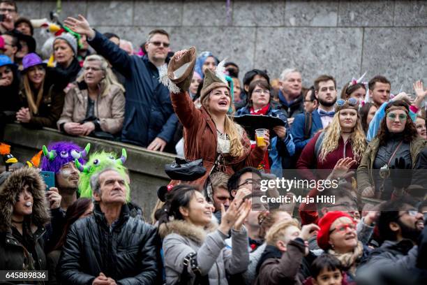 Visitors watch Rose Monday parade on February 27, 2017 in Cologne next to the Cathedral, Germany. Political satire is a traditional cornerstone of...