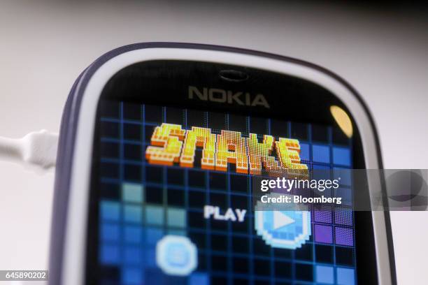 The snake games sits on the screen of a Nokia 3310 mobile phone, manufactured by HMD Global Oy, on the opening day of the Mobile World Congress in...