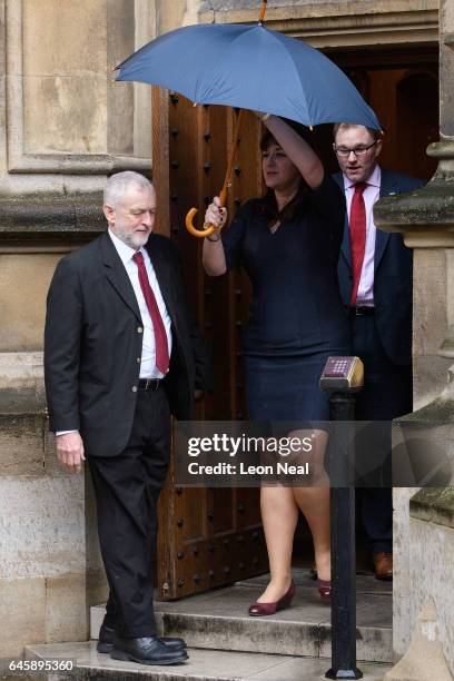 Labour Party leader Jeremy Corbyn holds the door open before welcoming the new Labour MP for Stoke Gareth Snell outside the Houses of Parliament on...