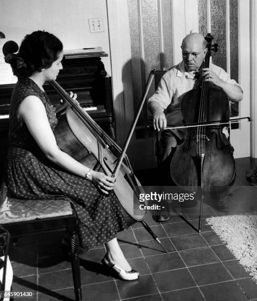Spanish musician Pablo Casals gives a lesson to his pupil Martina Montanez in his home in San Juan, in 1956. Pablo Casals married Martina Montanez 03...