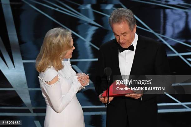 Actress Faye Dunaway and actor Warren Beatty arrive on stage to announce the winner of the Best Movie category at the 89th Oscars on February 26,...