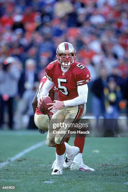 Quarterback Jeff Garcia of the San Francisco 49ers moves back to pass the ball during a game against the St. Louis Rams at 3Com Park in San...