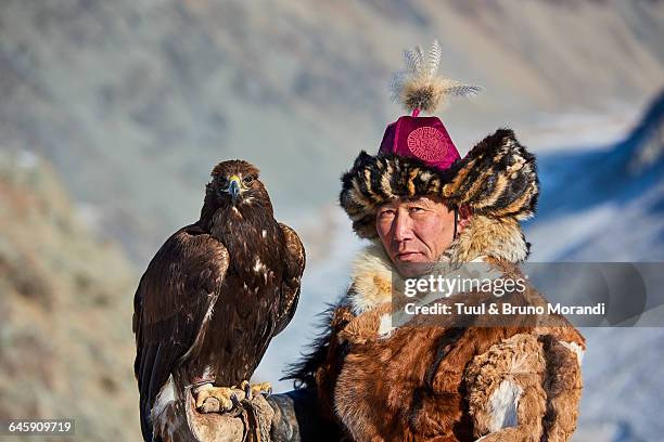 mongolia, bayan-olgii, eagle hunter - kazakhstan man stock pictures, royalty-free photos & images