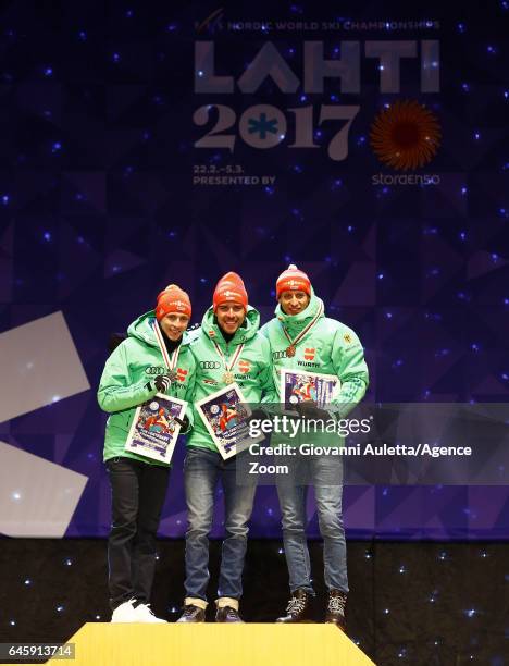 Eric Frenzel of Germany wins the silver medal, Johannes Rydzek of Germany wins the gold medal, Bjoern Kircheisen of Germany wins the bronze medal...