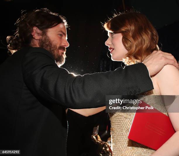 Actors Casey Affleck and Emma Stone greet backstage during the 89th Annual Academy Awards at Hollywood & Highland Center on February 26, 2017 in...