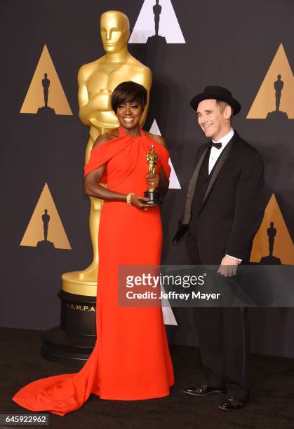 Actress Viola Davis , winner of the award for Actress in a Supporting Role for 'Fences,' poses with presenter actor Mark Rylance in the press room...