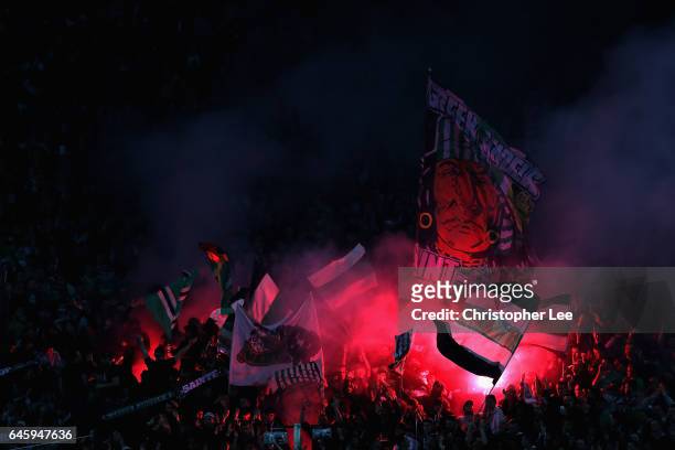 Saint-Etienne fans with flares during the UEFA Europa League Round of 32 second leg match between AS Saint-Etienne and Manchester United at Stade...