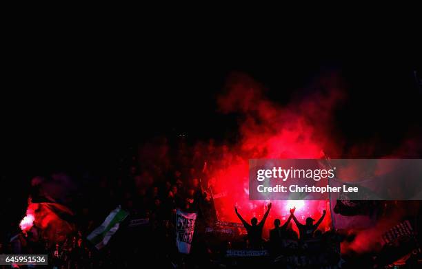 Saint-Etienne fans with flares during the UEFA Europa League Round of 32 second leg match between AS Saint-Etienne and Manchester United at Stade...