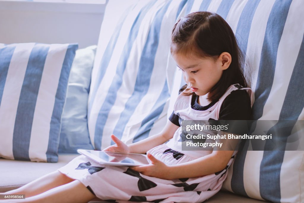 Toddler learning new things on a tablet