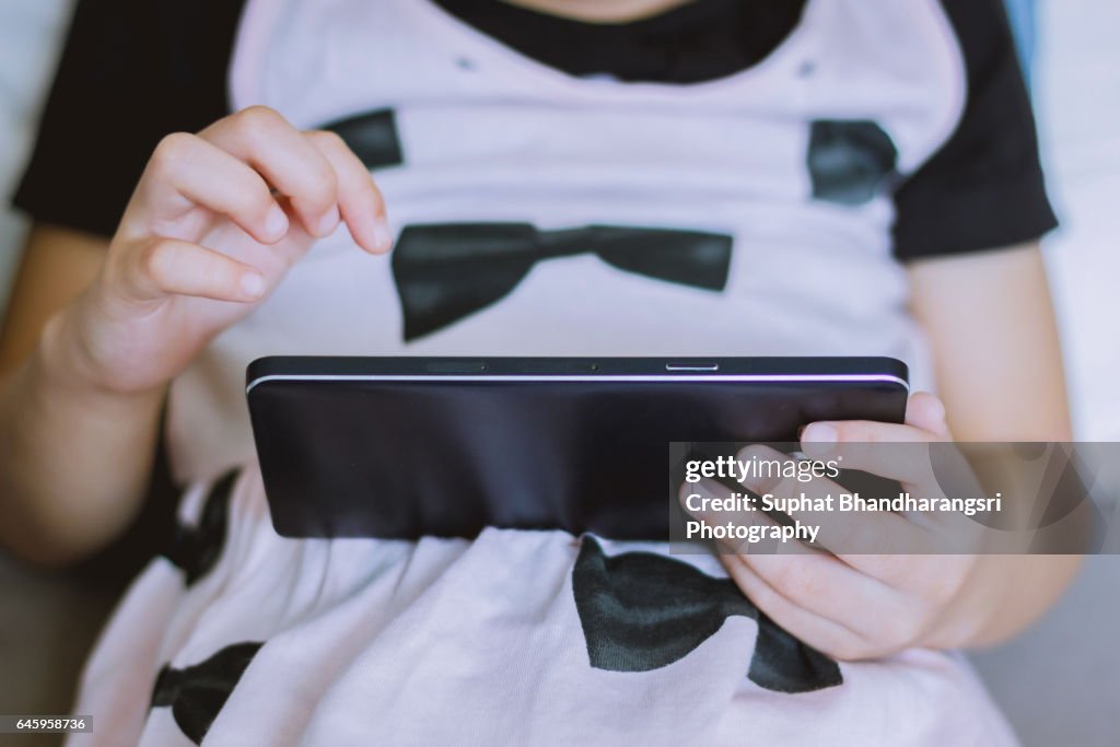 Toddler playing a smartphone