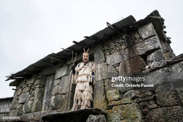 Reveller with wooden mask and carnival garb during the traditional Celtic carnival 'Caretos' in Lazarim on February 27, 2017 in Lamego, Portugal....