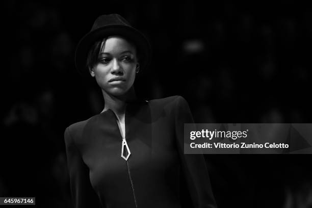 Model walks the runway at the Giorgio Armani show during Milan Fashion Week Fall/Winter 2017/18 on February 27, 2017 in Milan, Italy.