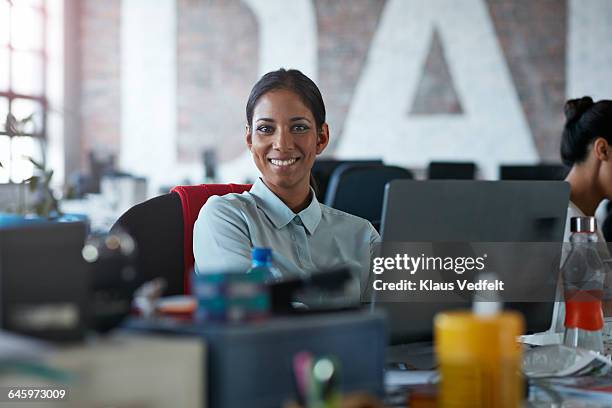 portrait of cool businesswoman at her desk - portrait of cool creative businesswoman at office bildbanksfoton och bilder