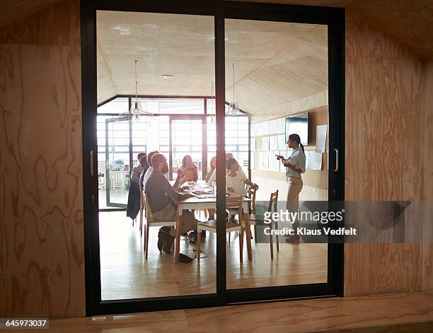 woman doing presentation in modern meeting room - sliding door imagens e fotografias de stock