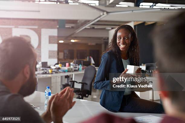 businesswoman presenting in front of co-workers - progress pride stock pictures, royalty-free photos & images