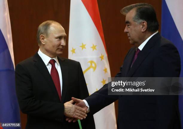 Russian President Vladimir Putin shakes hands withTajik President Emomali Rahmon during their talks in Dushanbe,Tajikistan, February 27, 2017. Putin...