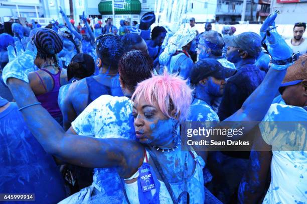 Ouvert revellers covered in blue paint dance and parade with the Rapso music band 3canal during the 20th anniversary celebration of their song Blue...