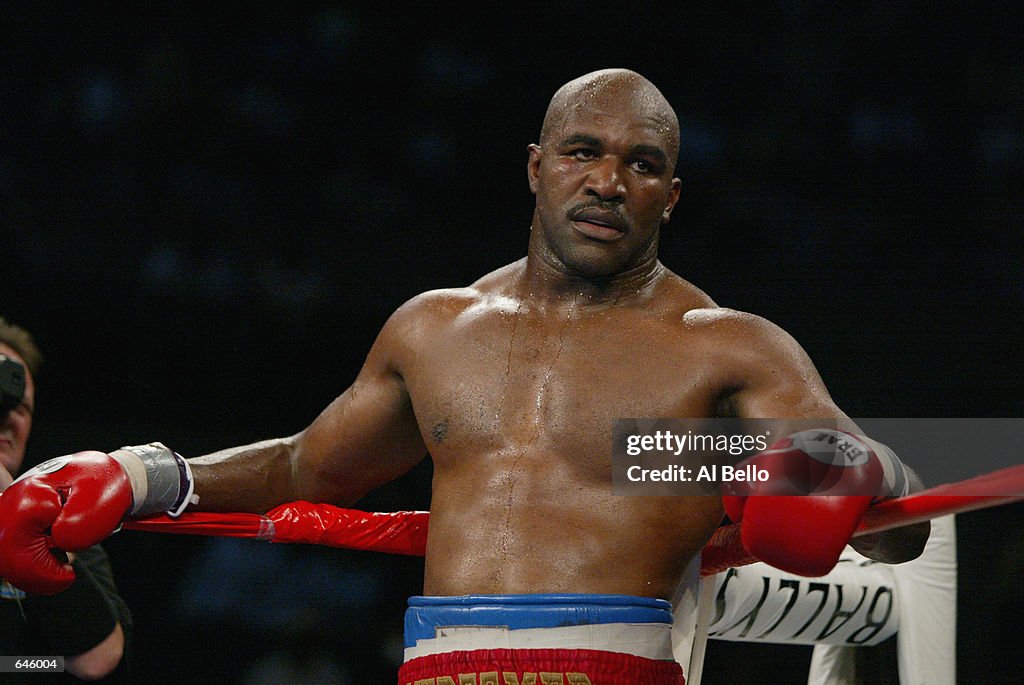 Holyfield Ripped Evander Holyfield waits in his corner during the heavyweight title ...
